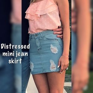 Light denim distressed jean skirt